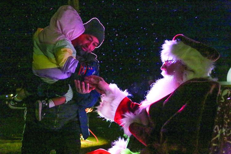 11-28-25 NoCo Tree Lighting handing bell