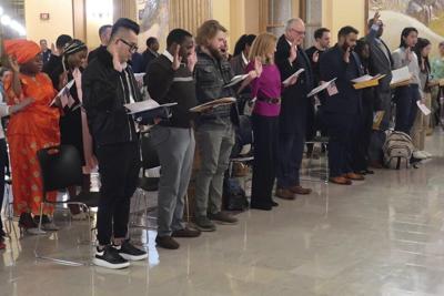 Dozens of immigrants from 18 nations take the oath to become U.S. citizens on Jan. 27, 2025, in Topeka, Kan.