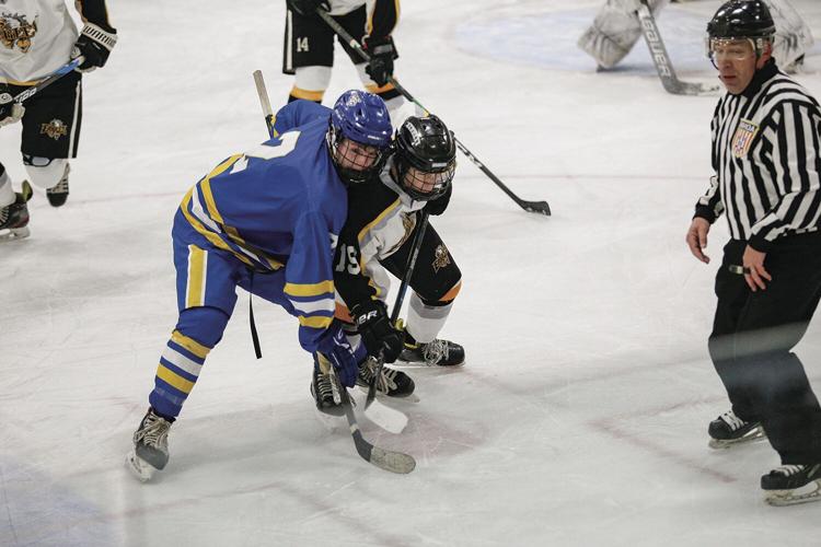 12-27-22 Peter Hall Xmas Tournament micklon-keefe after faceoff