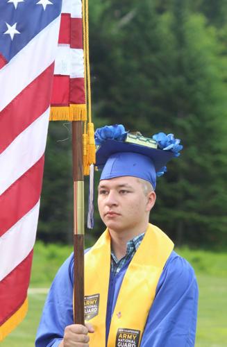 GHS graduate Michael O'Malley holds the American flag