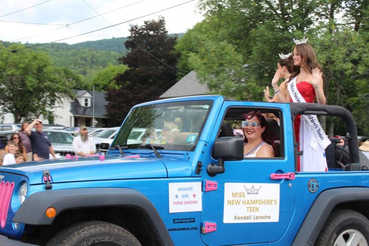 Miss New Hampshire Teen Kendall Laroche (standing right) waves to paradegoers