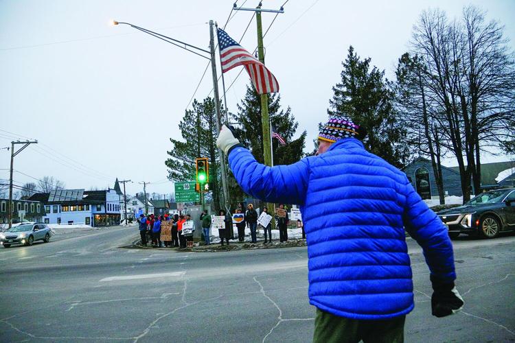 03-04-25 Trump Protest walking with flag