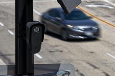 License plate readers like this one could soon be joined by sensors that detect phones inside passing cars.
