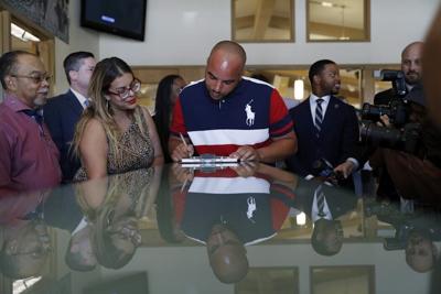 Javon Jackson, center, was able to register to vote following passage of a 2019 Nevada law that restored voting rights to formerly incarcerated individuals.