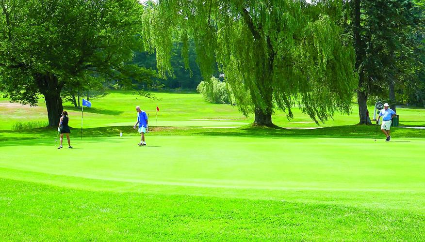 Golf Column - White Mountain Seniors - 3 on green at Waukewan