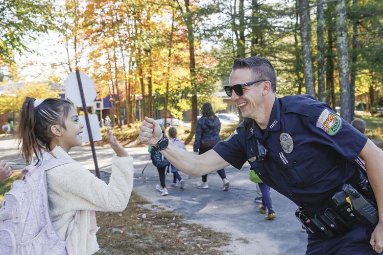 10-06-22 PT Walk to School fist bump with officer