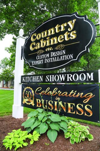 07-07-26 Country Cabinets 50th sign vertical