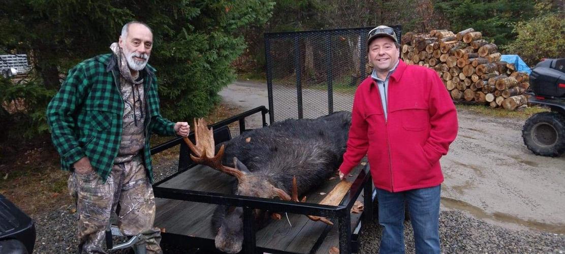 Mike Seguin and Mike Gilbert with moose