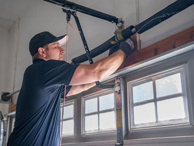 A Plus Garage Door Repair Highlights Critical Safety Concerns with High-Tension Spring Systems
