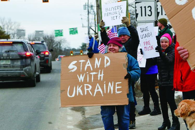 03-04-25 Trump Protest walking with sign