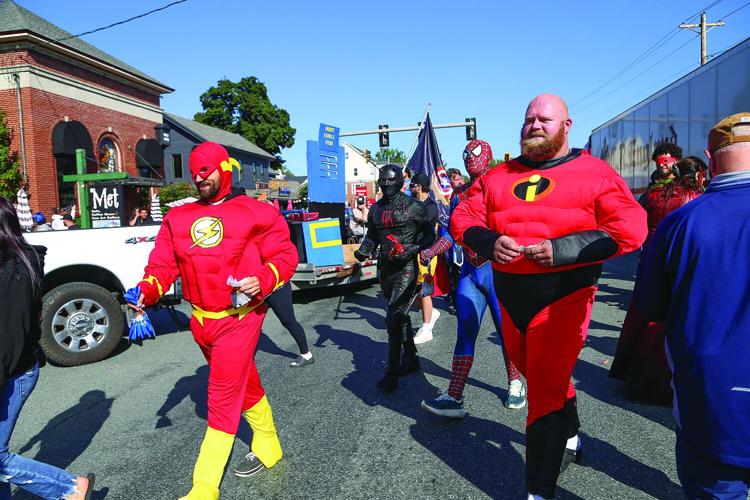 09-12-26 Mud Bowl Parade heroes walking