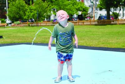 06-23-25 Heat Wave smile on splash pad