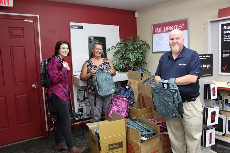 Verizon store gives away over 200 backpacks