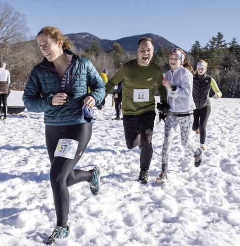Jackson Turkey Trot - lap 1 - four runners - two smiling