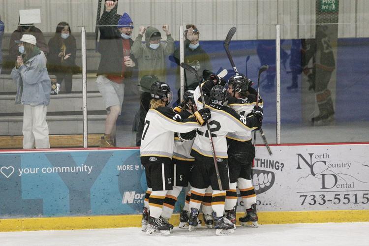 02-21-22 KHS Hockey laughland goal hug
