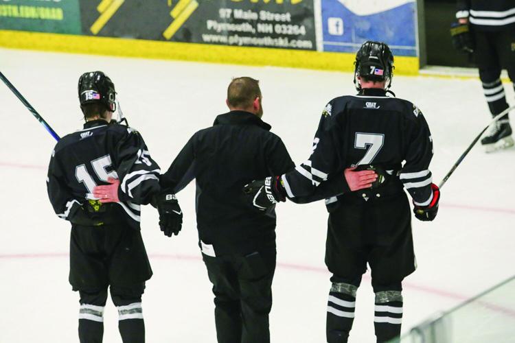 03-11-26 KHS-BG Frozen Four coach with seniors 2