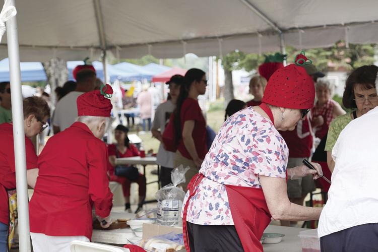 06-26-21 Strawberry Fest strawberry hat servers from back