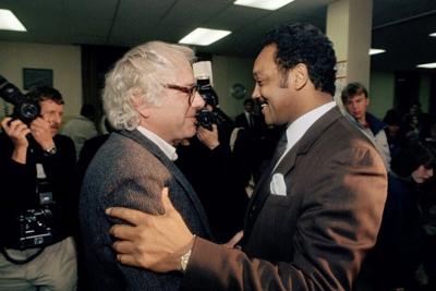 Bernie Sanders, then the mayor of Burlington, greets Jesse Jackson backstage at a 1988 Vermont rally where he endorsed Jackson's presidential bid.