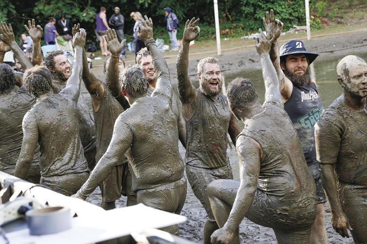 09-08-24 Mud Bowl heroes celebrating high-fives