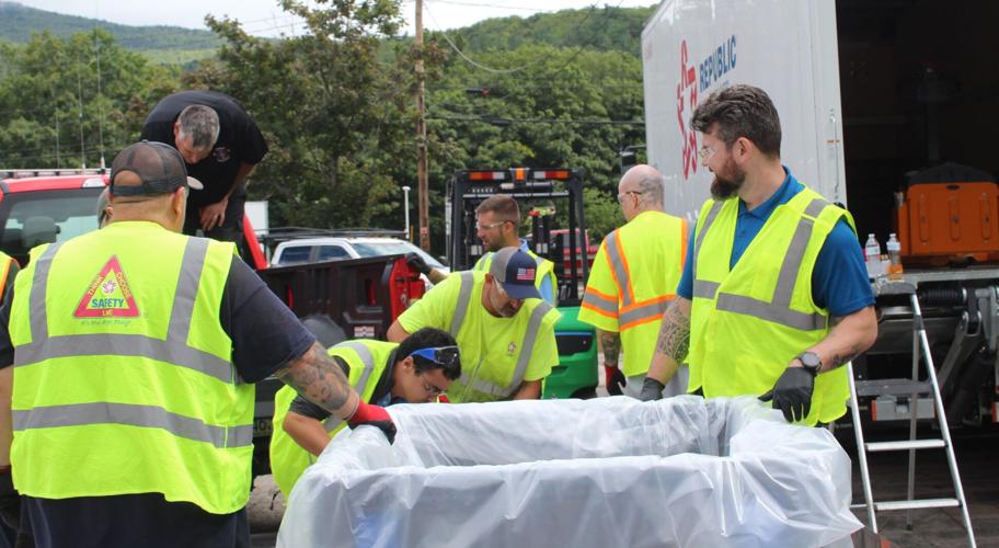 Revive Environmental specialists load containers