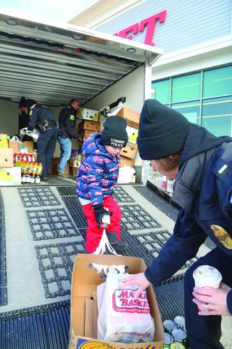 12-06-25 Conway PD Food Drive mom and son vertical