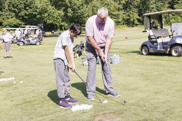 07-14-22 Junior Golf helping with form medium