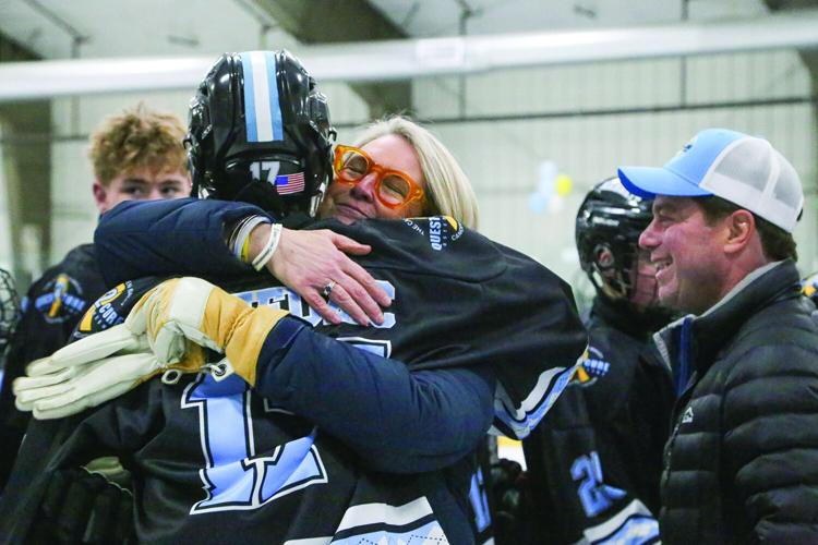 02-14-26 KHS Hockey Fights Cancer board hug