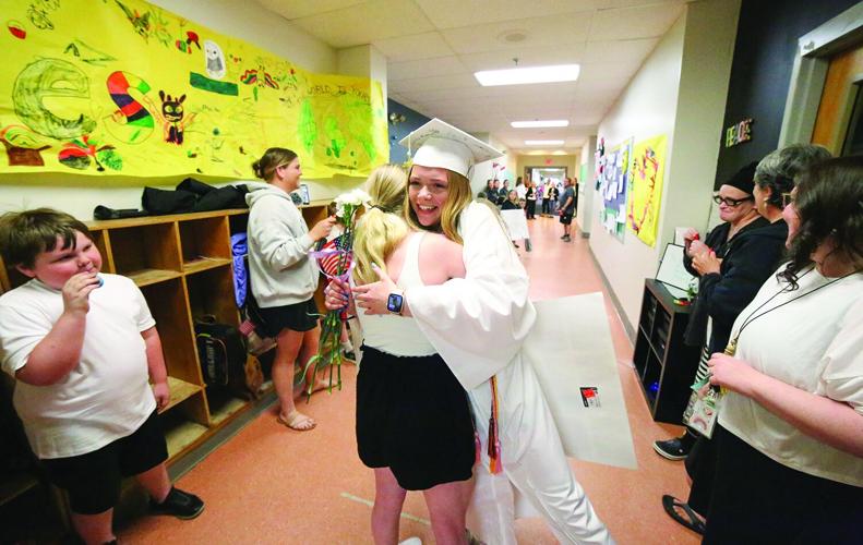 06-13-25 Senior Walk hug sisters