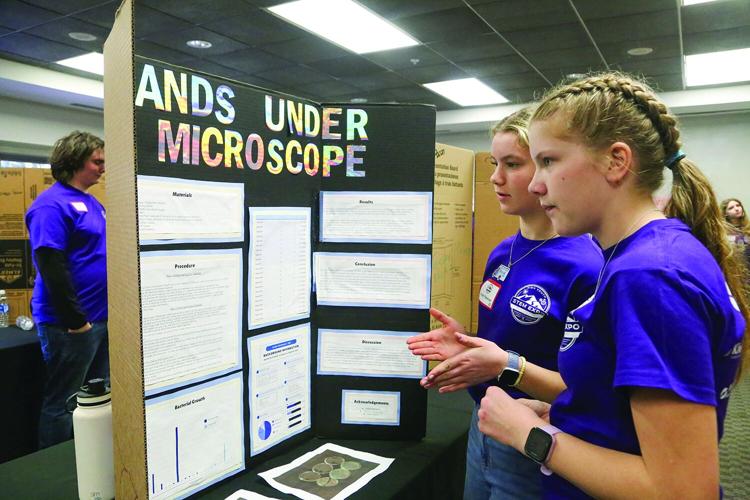 03-18-26 STEM Expo talking classmate