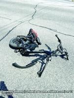 Man injured in e-bike, truck collision