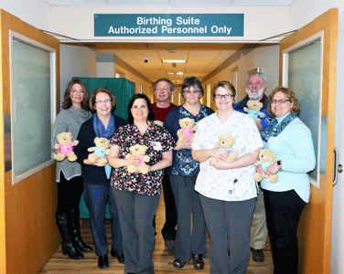 Badger Realty North donates stuffed bears to Androscoggin Valley Hospital