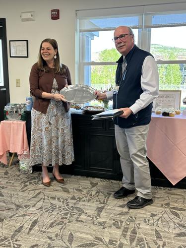 Bridget Laflamme prepares to view the latest engraved name honoring the Sylvia Evans Award recipient: Hers.