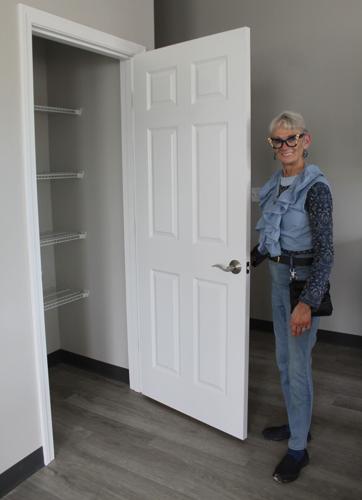 Kathy Malloy shows off a closet in a Brown School apartment