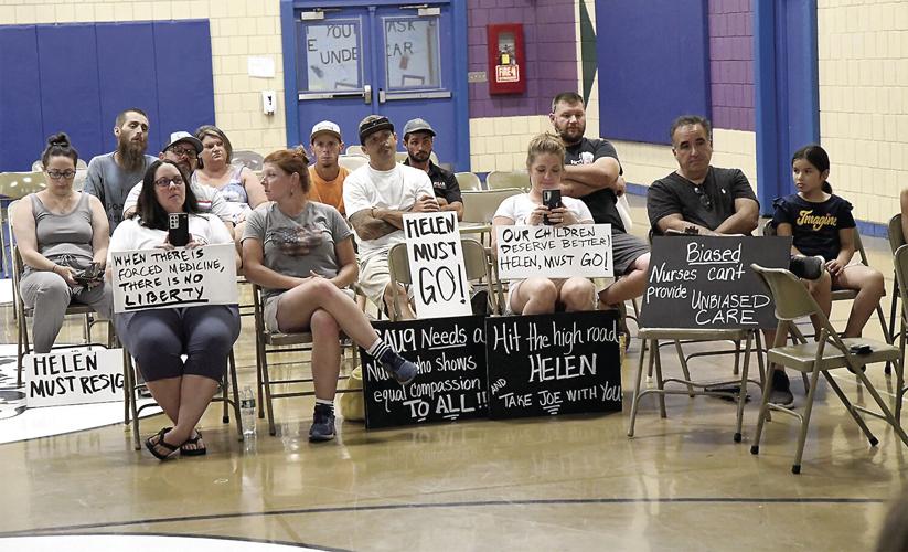 Helen Crowell early retirement - people with signs