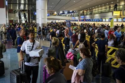 Passengers fill a terminal at Harry Reid International Airport in Las Vegas on July 19, 2024, after a major internet outage disrupted flights worldwide.