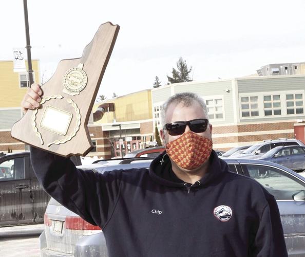 Ski jump named - Chip Henry with trophy