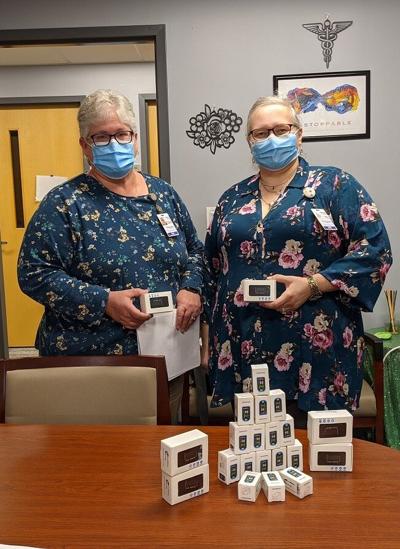 Denise White and Vicky Kirch with pulse oximeters
