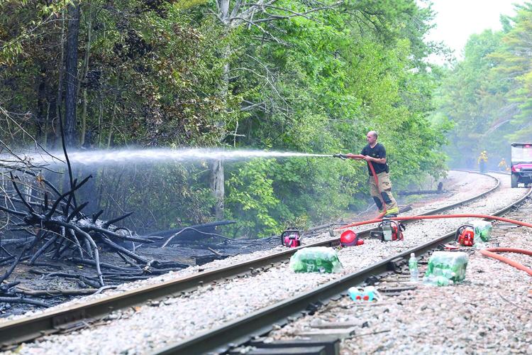 08-13-25 Holiday Inn-Brush Fire hosing tracks wide