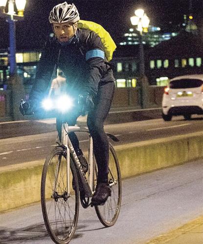 Wheel Family Fun - Guy biking with two lights