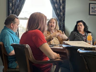 State Rep. Corinne Cascadden (D-Berlin) (center) reviews House education bills