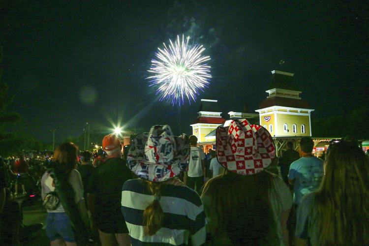 07-04-26 Fourth NoCo fireworks behind hats