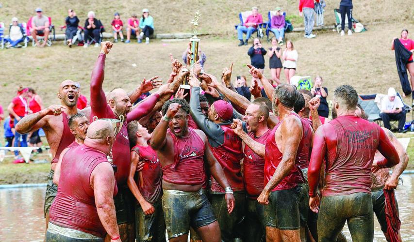 09-07-25 Mud Bowl reaching trophy