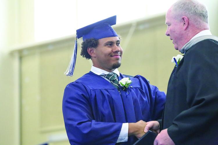 05-24-25 FA Graduation shaking hands tight