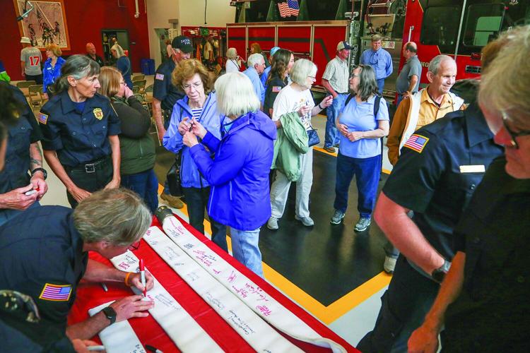 06-06-26 Jackson Fire Dedication signing hose medium