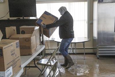 12-19-23 Flood Damage carrying boxes side