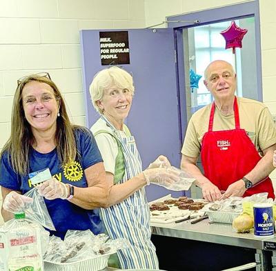 CL w14 community kettle Lisa, Ann & Dan in kitchen.tif