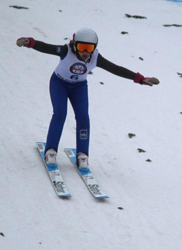 Ella Klein lands after completing her trial jump