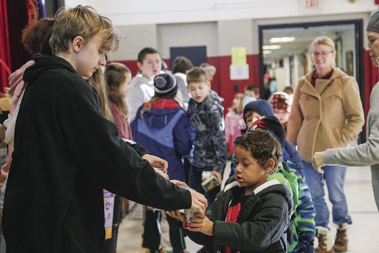 11-26-22 Food March handing horizontal