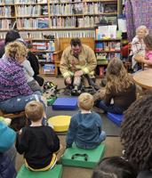 Firefighter reads to kids at Berlin Public Library