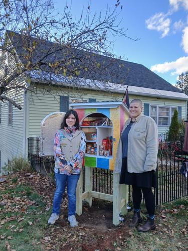 Wednesday Belanger (left) and Kirstan Knowlton stand outside the Willard Street pantry
